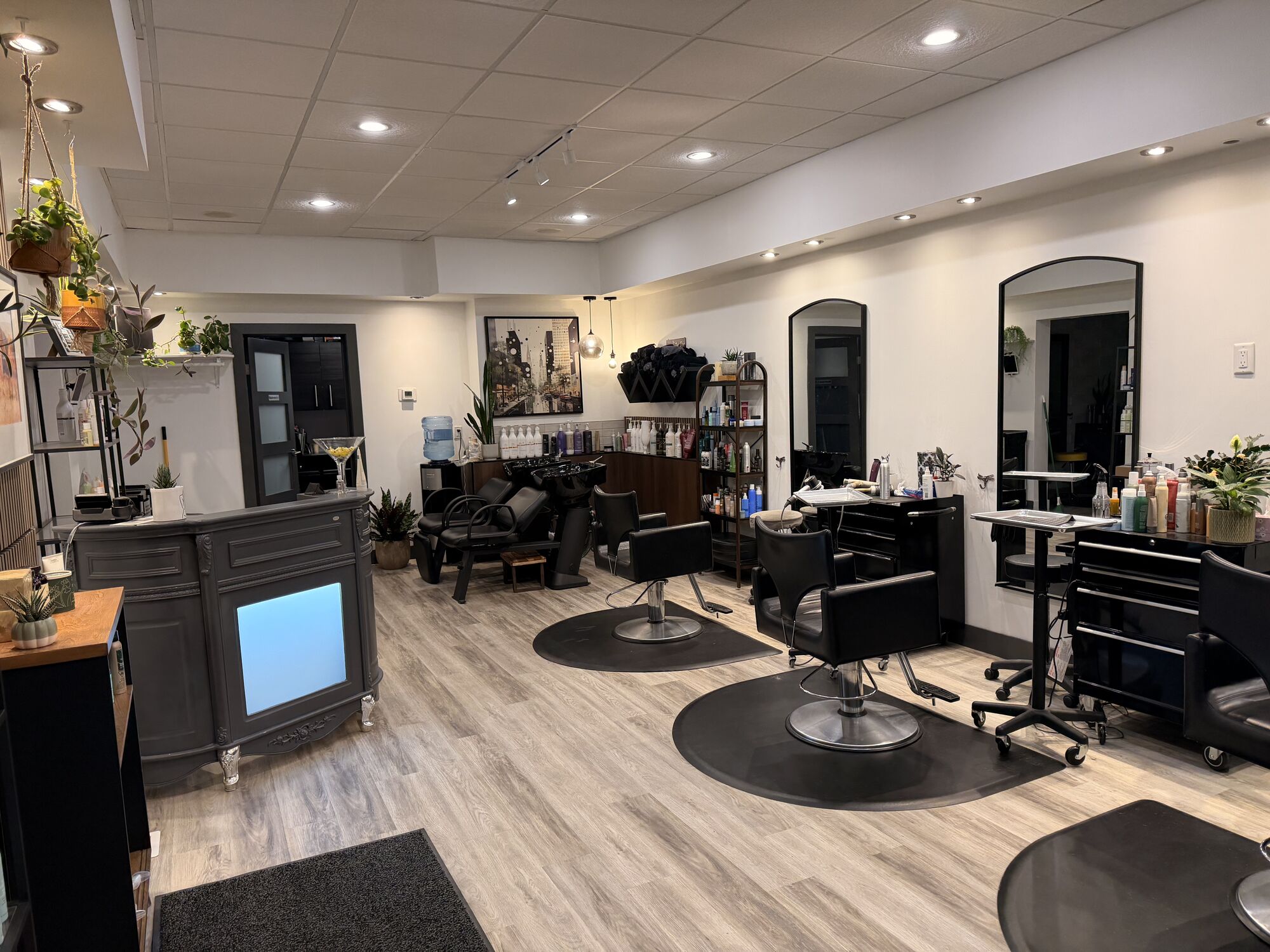 Styling stations and mirrors inside Cabello Salon + Co. in Regina